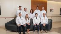 A group of radiation oncology residents reviewing a patient case.